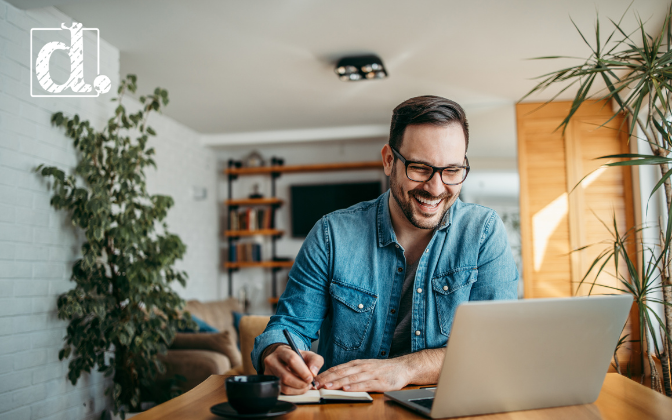 man working on computer on home